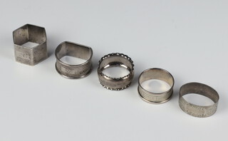 A silver engine turned hexagonal napkin ring Sheffield 1953 and 4 others, 112 grams 