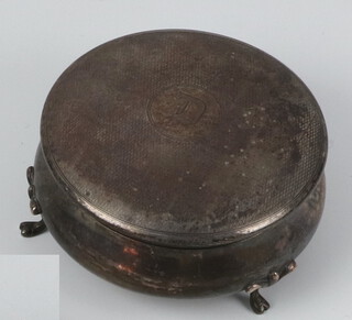 A circular silver trinket box on scroll feet Birmingham 1946 8cm and a propelling pencil