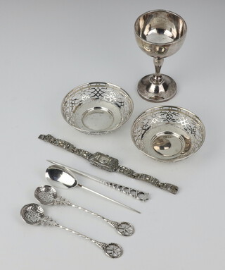 A silver cup Birmingham 1932, 2 pierced bowls, 3 spoons, a skewer and a marcasite watch, 185 grams  