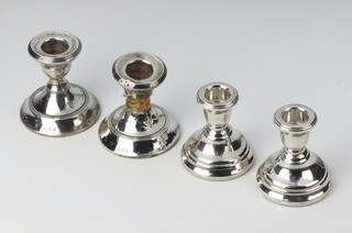 A pair of silver dwarf candlesticks Birmingham 1979, 6.5cm, a ditto Birmingham 1946 7cm 