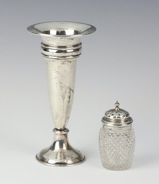 A silver posy vase of tapered form, rubbed marks, 13cm and a silver mounted pepper 