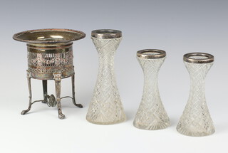 A pair of silver mounted Edwardian cut glass waisted vases Birmingham 1909 12cm, a larger ditto 15cm and a plated holder 