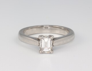 A platinum, emerald cut single stone diamond ring approx. 0.5ct, the colour G/H, clarity SI1, 5.6 grams, size J 1/2