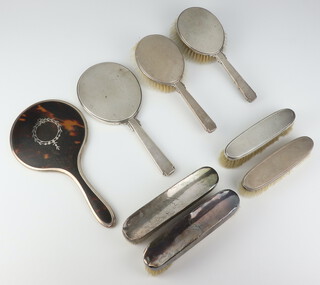 A silver 3 piece dressing table set London 1950 together with 4 clothes brushes and a silver and tortoiseshell hand mirror 