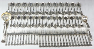 An extensive mid Victorian silver Kings Pattern canteen of cutlery comprising 24 dessert spoons, 24 table spoons, 2 ladles, a sifter spoon, a large ladle, a basting spoon, a butter knife, 12 dessert forks and 18 dinner forks, engraved with monogram, 7550 grams, mixed dates - 1875, 1876 and 1878, maker Thomas Smily  