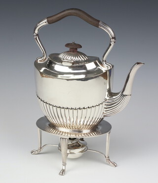 An Edwardian silver plated demi-fluted tea kettle on stand with burner, on claw feet, 32cm  