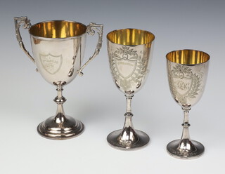 A Victorian silver plated 2 handled trophy cup 21cm, 2 other cups 