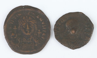 A pair of brass coins of Justinian minted by the Byzantine States in 527-565AD, a brass sestertius of Maximus, Rome 235/6AD, a group of brass and bronze coins from the 2nd and 3rd Centuries AD 