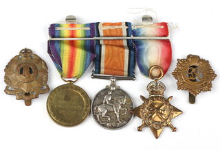 A First World War group of medals comprising War medal, Victory medal and 1914-15 Star to 2947.Pte. F.J.Searle.10/Lond,R together with 2 cap badges 