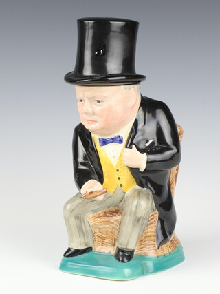 A Kirklands Etruria character jug in the form of seated Winston Churchill with removable top hat 25cm 