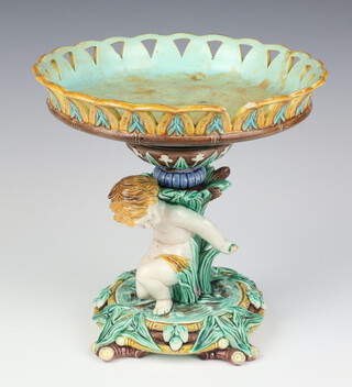 A 19th Century Wedgwood Majolica centre piece in the form of a kneeling cherub 22cm 