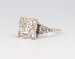 A white metal 18ct and plat. Art Deco diamond cocktail ring, the mine cut centre stone 0.75ct, size O with mine cut corner stones, 3.7 grams 