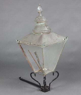 A 19th/20th Century copper and iron  lamp housing with bracket 127cm h x 51cm w x 47cm d 