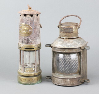 An E Thomas and Williams Aberdare miner's safety lamp together with an Overtarting pattern 4895 masthead lantern 20cm h x 12cm x 10cm 