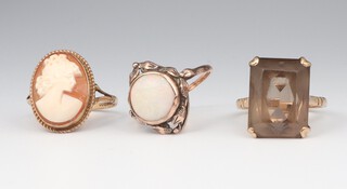 A 9ct yellow gold smokey quartz ring, a ditto opal ring and cameo ring sizes N 1/2, P and P, gross weight 11.2 grams 