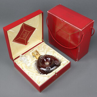 A 70cl bottle of Louis XIII De Remy Martin Grande Champagne Cognac, contained in a Baccarat glass bottle, complete with certificate numbered X2907, contained in a presentation box and outer box sleeve