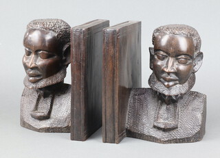 A pair of African carved hardwood bookends decorated busts 21cm h x 17cm w x 13cm d 