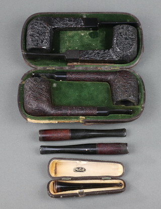 Two Astley pipes marked Astley Jermyn Street London 10cm, 2 Dunhill pipes the bowls marked 40/7, 2 Dunhill cigarette holders and 1 other cased 