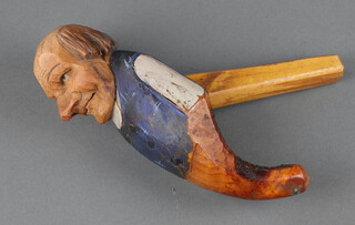 A pair of Swiss carved and painted nut crackers in the form of gentleman 17cm x 16cm 