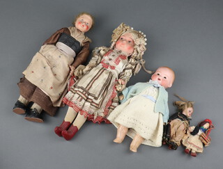 A collection of 5 Victorian and later dolls to include 2 paper mache 34cm l, 1 bisque Armand Marseille marked AM Germany 351/3/OK 25cm l and a porcelain miniature doll 12cm l 