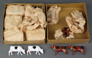 Benson Toys, 2 trade boxes of cows, 1 box containing Series F416 cows (x5), the other containing F425 cows (x24), in original wrapping and inserts, together with a trade box of Benbros Toys figures of farm labourers (x48)