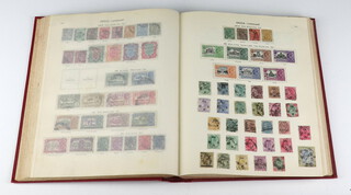 A New Ideal album of various world stamps including GB, Victoria including 2 penny blacks, Hong Kong, Palestine, India 