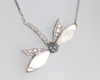 A white metal dragonfly necklace with mother of pearl wings set with brilliant cut diamonds, approx. 1.5ct and blue diamonds on an 18ct white gold chain 42cm, gross weight 15 grams, the dragonfly 57mm x 35mm 