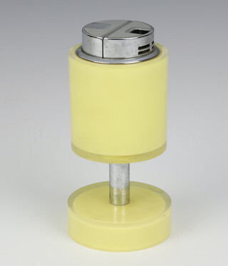 Sarome, a 1960's Art Deco style table lighter contained in a cylindrical plastic case 14cm h x 7cm diam