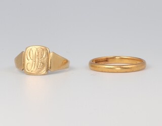 A 22ct yellow gold wedding band size L 2.4 grams, an 18ct yellow gold signet ring size L 1/2, 2.2 grams 