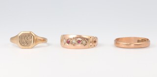 A 9ct yellow gold signet ring size M, ditto wedding band size M and a 9ct garnet and pearl ring size N, 5.4 grams 