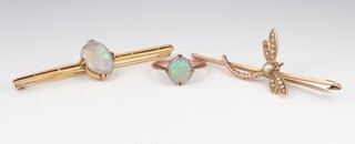 A 9ct yellow gold opal bar brooch, a ditto ring (chipped) and a yellow metal dragonfly brooch 6.3 grams 