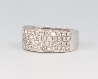 A white metal 750, wide, diamond set half eternity ring with diamond set sides 10.6 grams, size N  