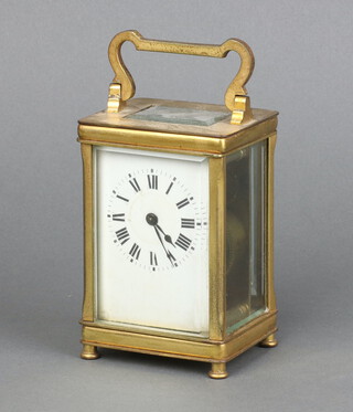 A 19th Century French 8 day carriage timepiece with enamelled dial, Roman numerals, contained in a gilt metal case 11cm x 6cm x 5cm, complete with key 