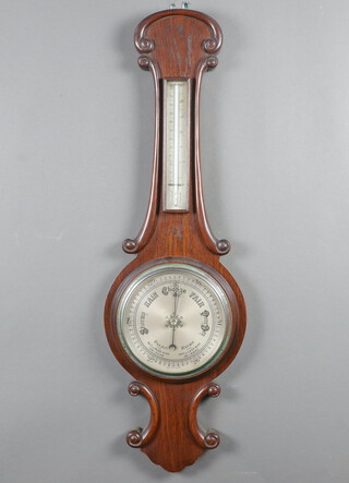 A 1930's aneroid barometer and thermometer with 18cm silvered dial, contained in a rosewood case 90cm h x 28cm w 