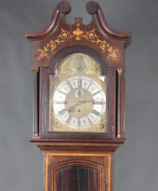 An Edwardian 8 day chiming longcase clock, having a 21cm brass arched dial with Roman numerals, silvered chapter ring and minute indicator, contained in an inlaid mahogany case 240cm h x 50cm w x 35cm d, complete with weights, no pendulum and no gongs   