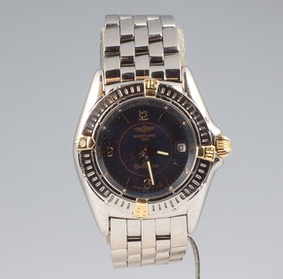 A lady's steel cased Breitling Callistino calendar wristwatch with blue dial and a bi-metallic case, numbered B52045.1 12970, contained in a 25mm case 