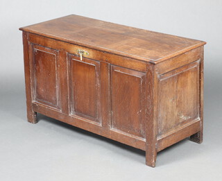 An 18th Century oak coffer of panelled construction with hinged lid and iron lock 64cm h x 110cm w x 48cm d 