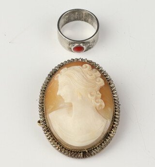 A gilt cameo brooch and a silver ring 