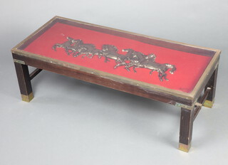 An Oriental style rectangular mahogany coffee table, the top decorated figures of running horses, raised on square tapered supports with H framed stretcher 36cm h x 108cm w x 46cm d 