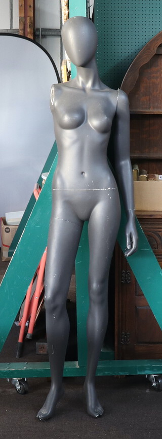 An articulated female mannequin (1 arm missing) 180cm h 