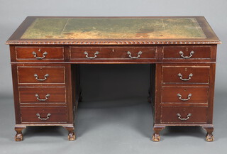 A mahogany kneehole pedestal desk with inset writing surface above 1 long and 8 short drawers, on cabriole supports 77cm h x 153cm w x 92cm d 
