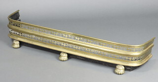 A 19th Century  pierced brass fender (dented in places)