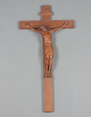 A carved hardwood crucifix 62cm x 31cm 