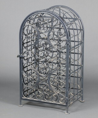 An arch shaped wrought iron 26 bottle wine rack with hinged door 86cm h x 36cm w x 46cm d