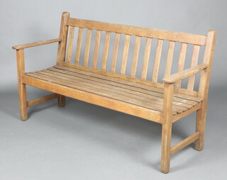 A slatted hardwood garden bench 158cm h x 150cm  