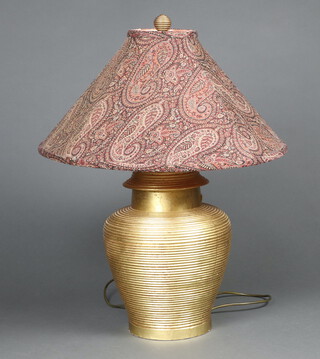 A gilt painted and turned wooden table lamp in the form of an urn with shade 46cm h x 36cm 