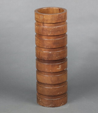 A hardwood stick stand 60cm h x 20cm diam.  
