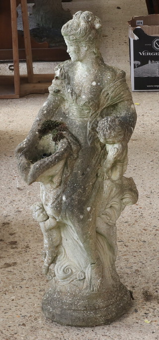A well weathered concrete garden fountain in the form of a standing lady 82cm h x 32cm 