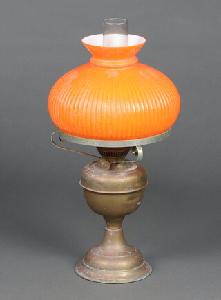 A 19th Century oil lamp with clear glass chimney, orange glass shade (f) 49cm x 24cm 