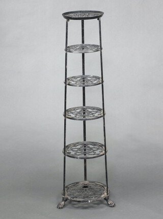 A Victorian style circular pierced metal 6 tier saucepan stand 123cm h x 26cm diam. 